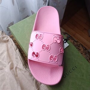 SOLD Another pair …Gucci logo rubber slides